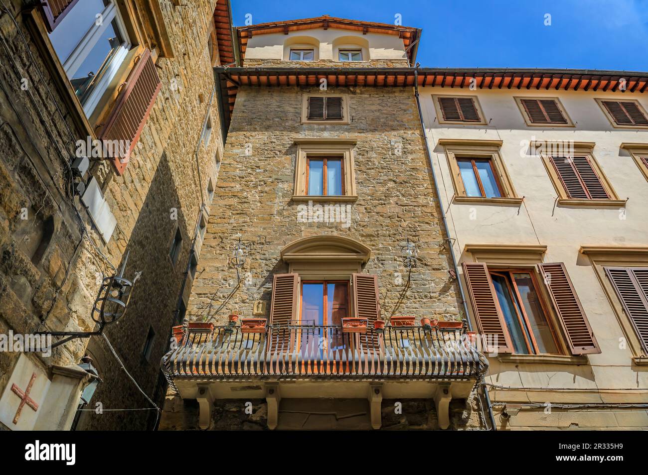 Medieval Renaissance gothic tower buildings along a narrow street in Centro Storico or Historic Centre of Florence, Italy Stock Photo