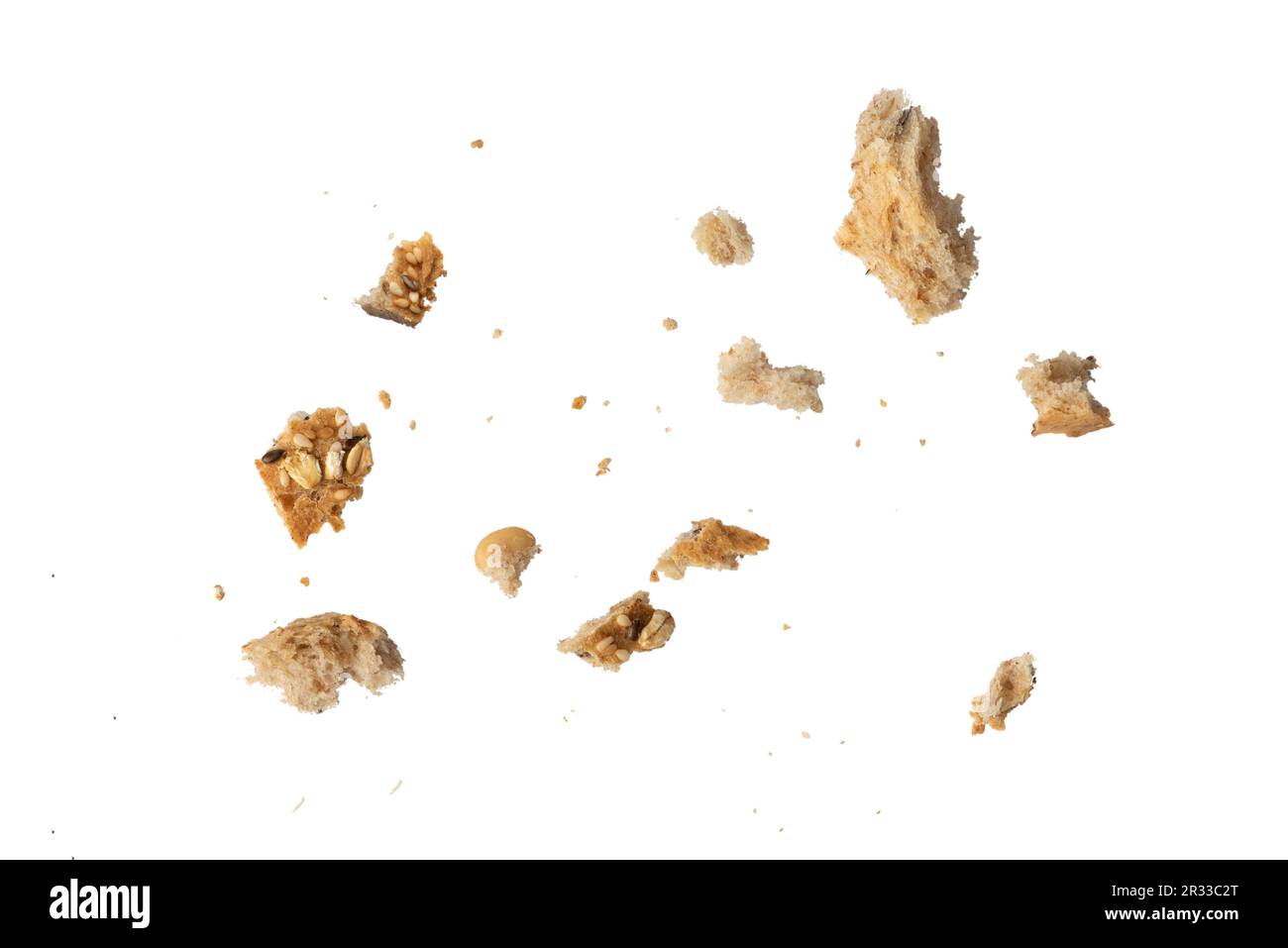 Crumbs of fresh whole grain bread isolated on white background. Isolate crumbs of different