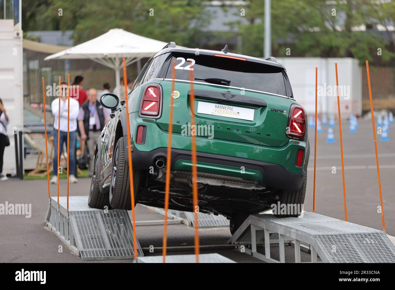 Mini Cooper S being test driven by customers up a ramp at the Mini driving experience at Circuit of Catalonia in Montmelo, Spain Stock Photo