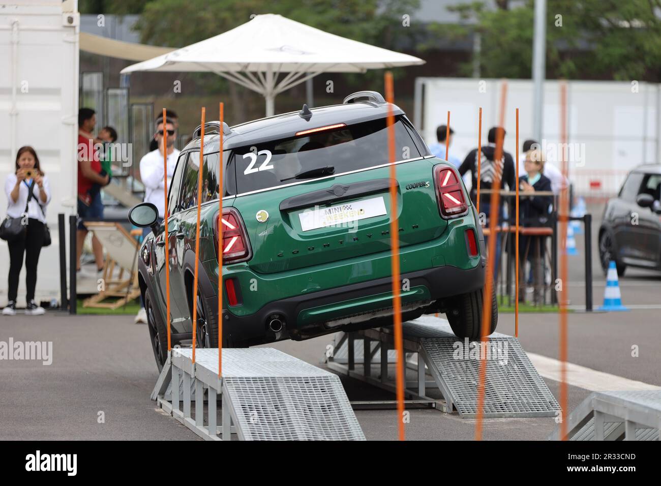 Mini Cooper S being test driven by customers up a ramp at the Mini driving experience at Circuit of Catalonia in Montmelo, Spain Stock Photo