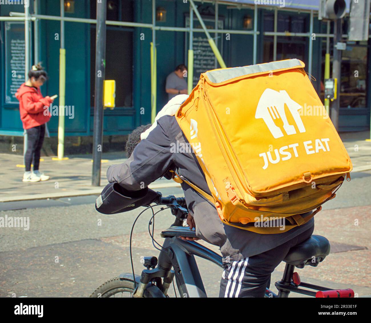 just eat delivery cyclist on the street Stock Photo