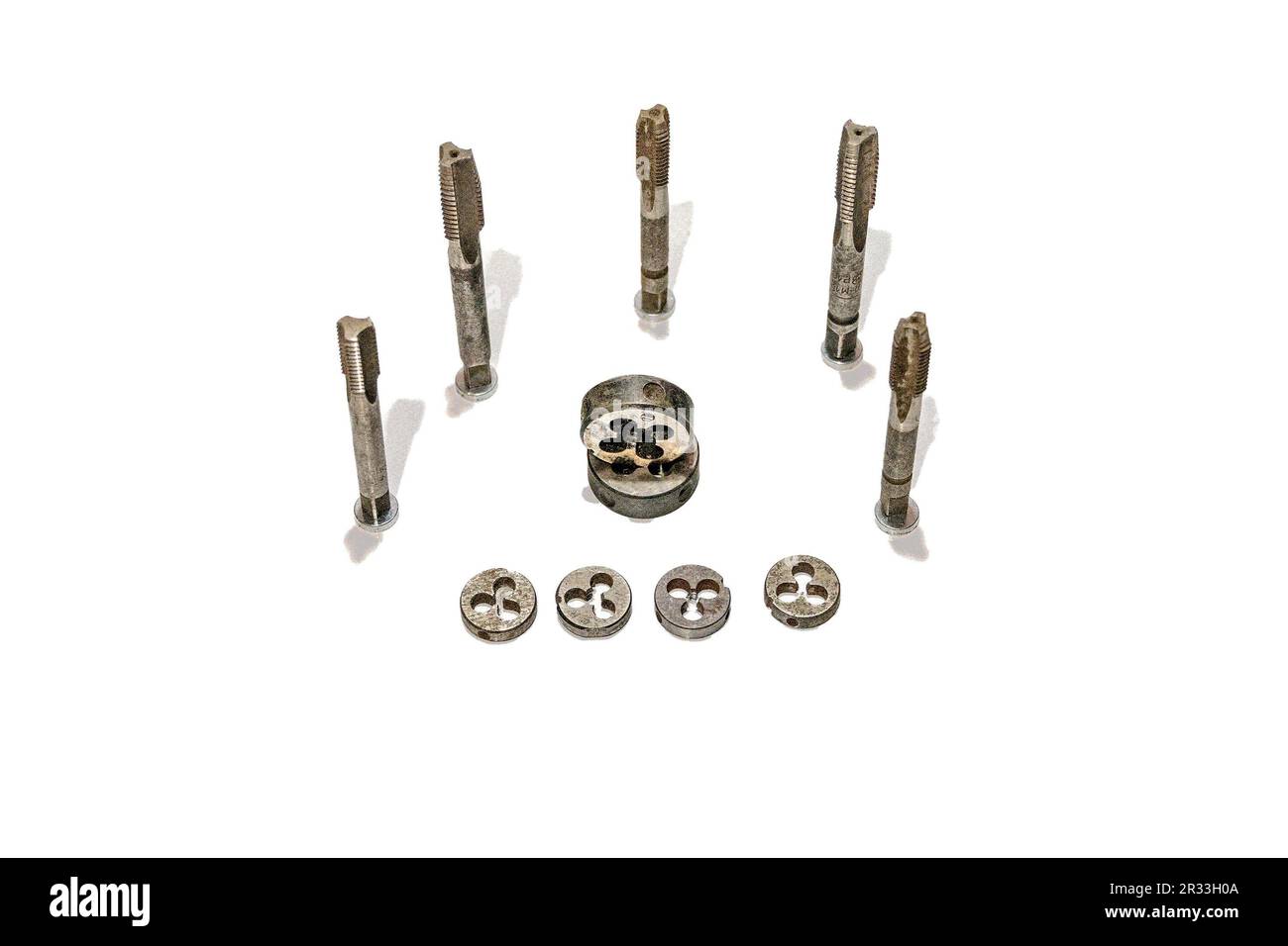 Taps and dies tools for metal carving against white background Stock