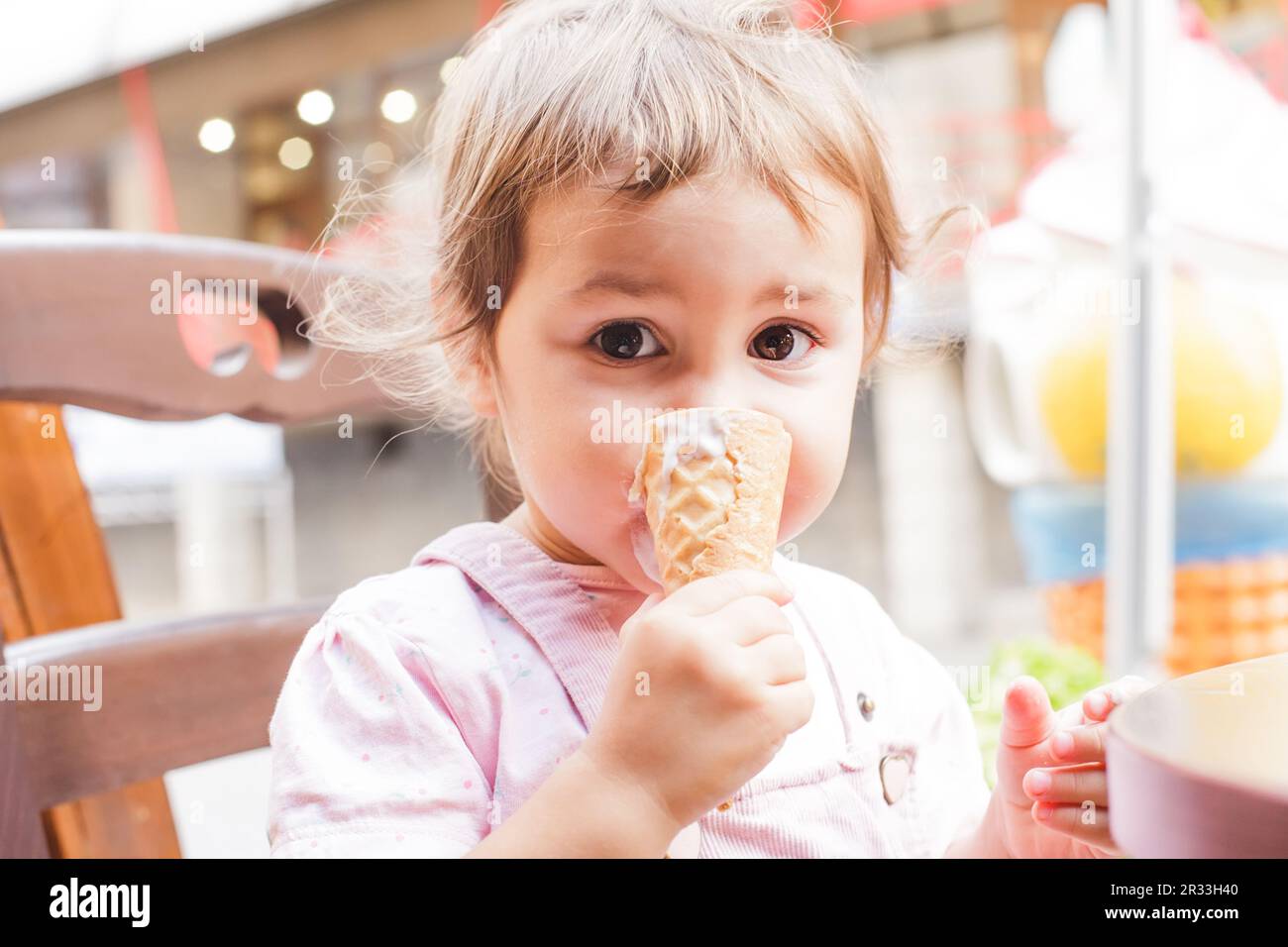 Girl eats an ice cream Stock Photo