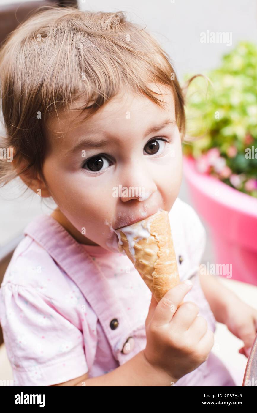 Girl eats an ice cream Stock Photo
