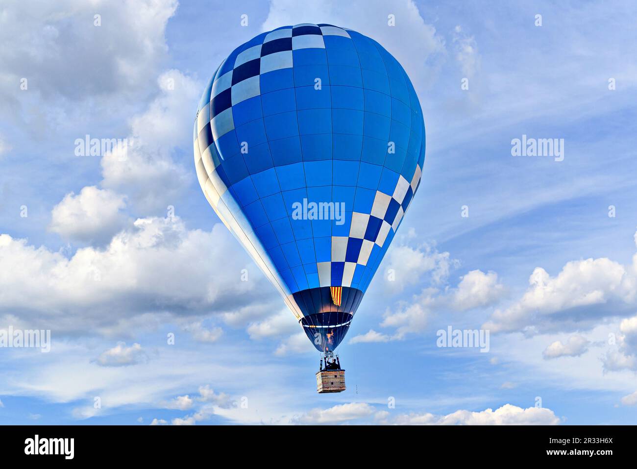 Blue hot air balloon flying on the blue sky with white clouds Stock ...