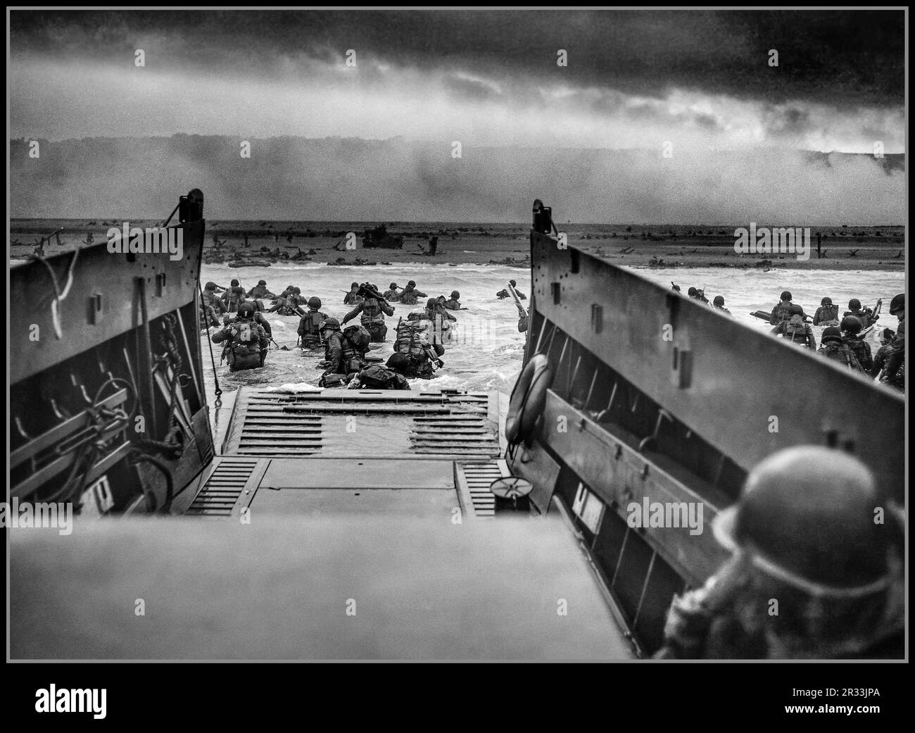 D-DAY UTAH BEACH WW2 Normandy landings  the landing craft boat landing operations on 6 June 1944 (termed D-Day) of the Allied invasion of Nazi Germany occupied Normandy France A LCVP (Landing Craft, Vehicle, Personnel) from the U.S. Coast Guard-manned USS Samuel Chase disembarks troops of Company A, 16th Infantry, 1st Infantry Division wading onto the Fox Green section of Omaha Beach (Calvados, Basse-Normandie, France) on morning of June 6, 1944. American soldiers encountered the newly formed German 352nd Division when landing. Smoke flares attempt to camouflage and direct landing troops. Stock Photo