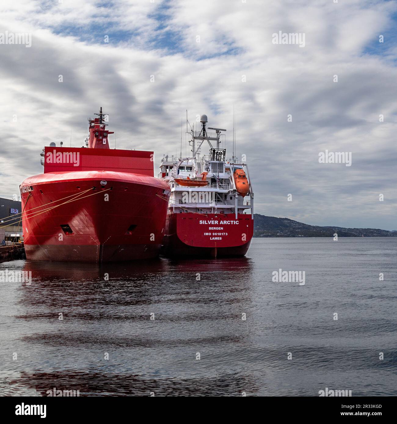 Cargo/container vessel Mary Arctica and reefer Silver Arctic alongside quay in Laksevaag, in the port of Bergen, Norway. Stock Photo