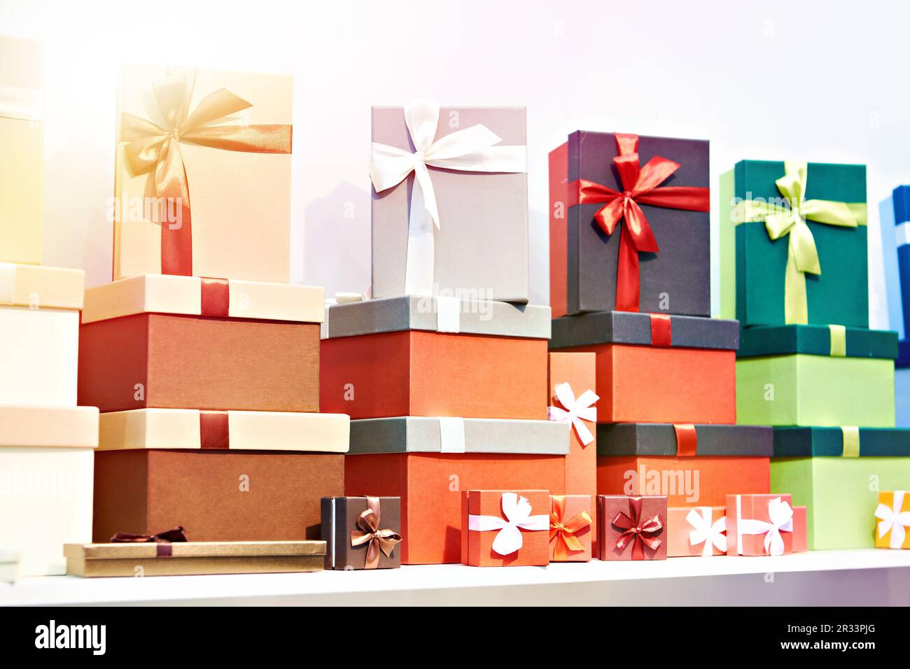 Gift boxes with ribbons on a store shelf Stock Photo