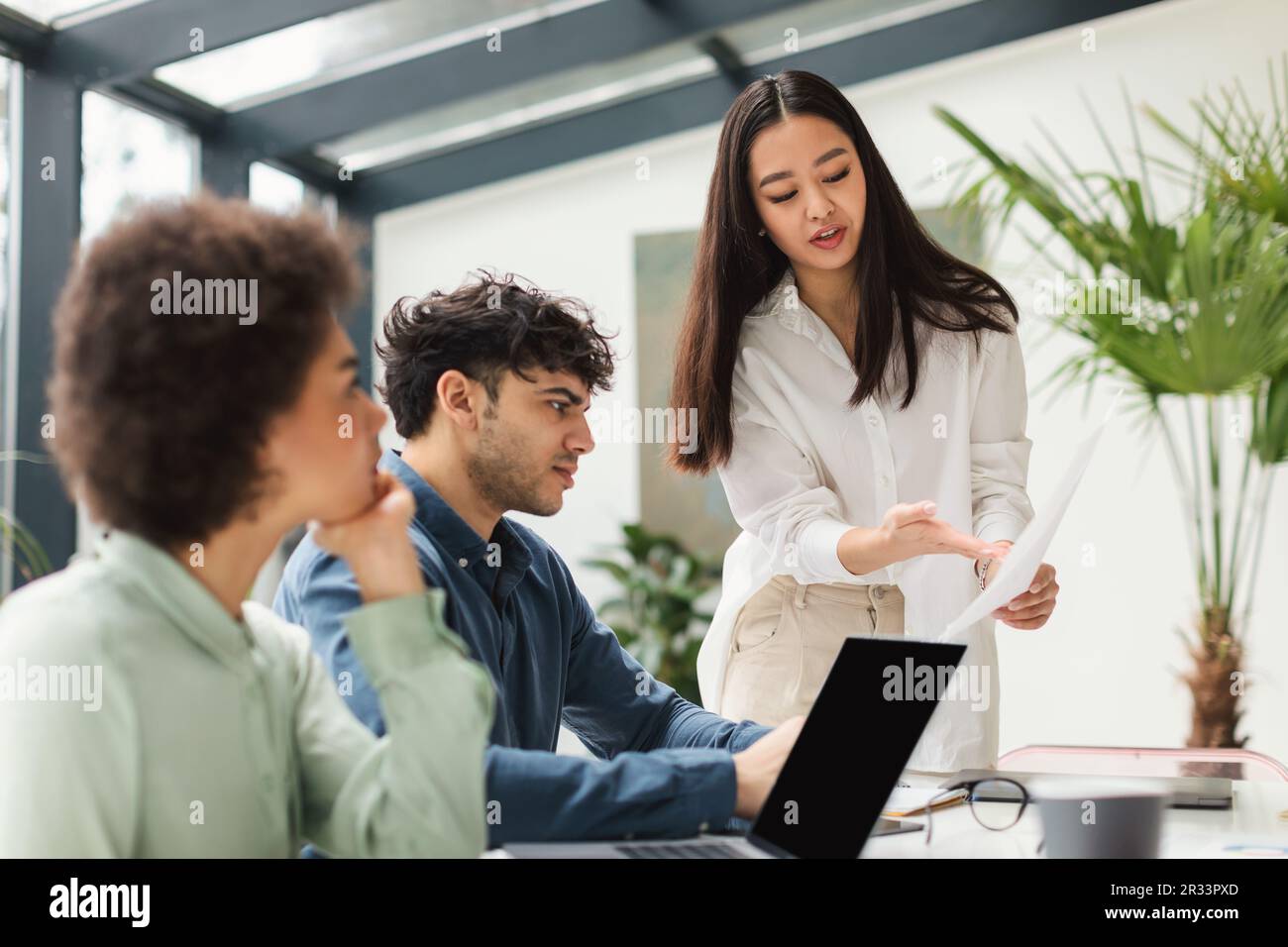 Diverse Business Team Analyzing Problems Working On Project In Office Stock Photo
