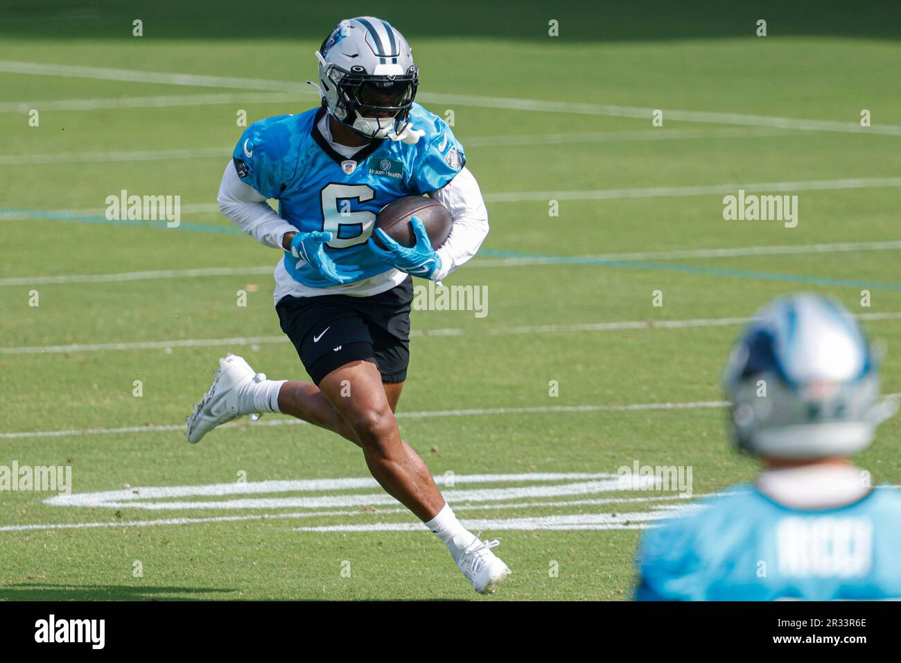 Carolina Panthers running back Miles Sanders runs after a catch at the