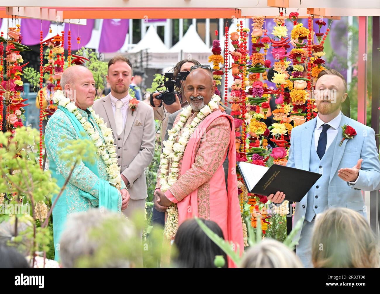 London, UK. 22nd May, 2023. Royal Hospital Chelsea, London, UK on May 22 2023. Newlyweds, Manoj Malde (R) and Clive Gillmor (L) celebrate tying the knot on the RHS and Eastern Eye Garden of Unity which hosted RHS Chelsea's first wedding.at the RHS Chelsea Flower Show at the Royal Hospital Chelsea, London, UK on May 22 2023. Credit: Francis Knight/Alamy Live News Stock Photo