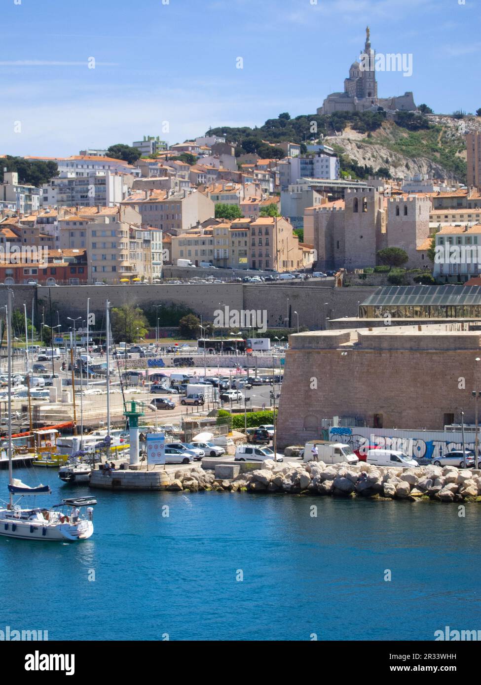 View of Marseille & Notre-Dame de la Garde from Port Hercule, in Marseille, France. Stock Photo