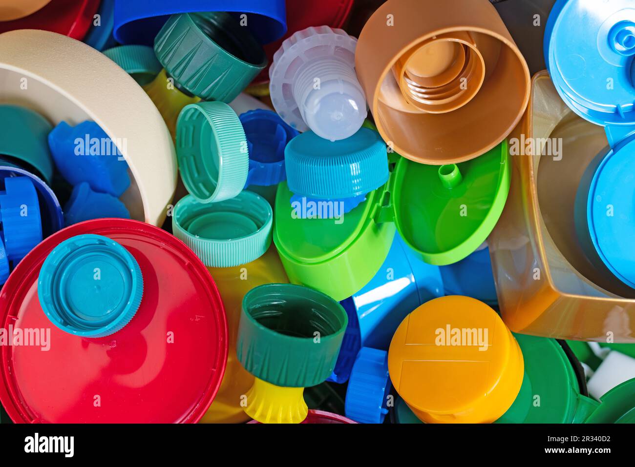 Various screw caps and caps made of plastic for recycling Stock Photo