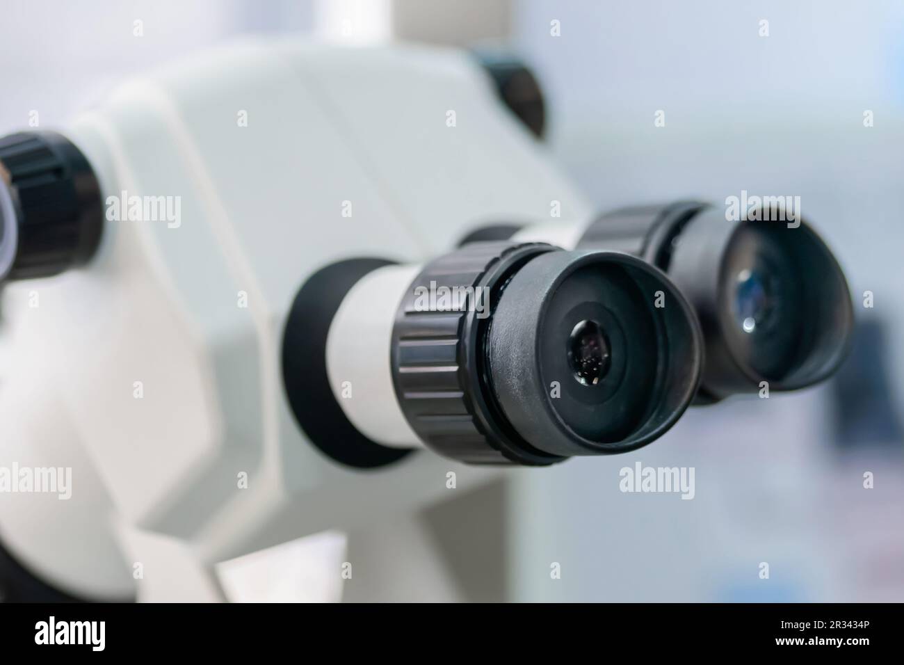 Ocular lens, eyepieces of white optical microscope close up Stock