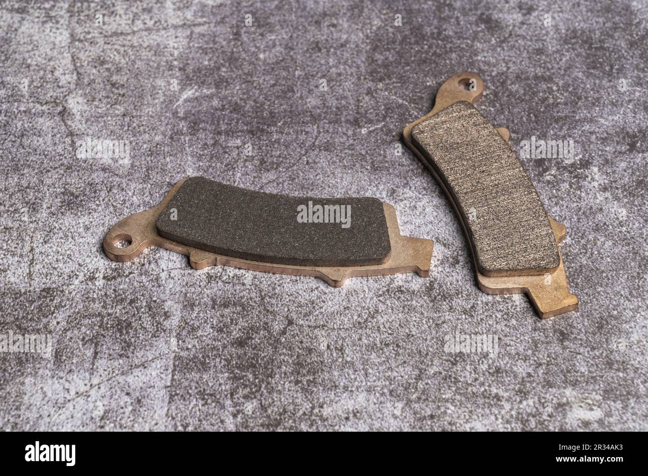 Brake pads are a component of disc brakes or rim brakes, used in automotive and other applications. Brake pads are made up of steel backing plates wit Stock Photo