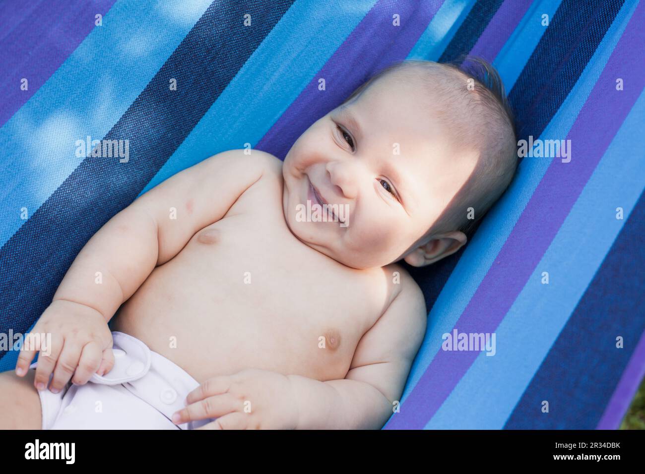 Baby in a hammock Stock Photo