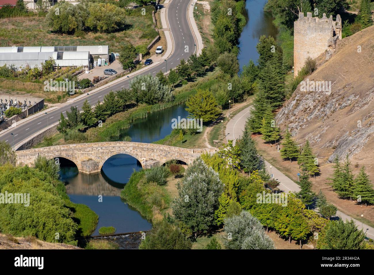 Puente romano sobre el río Ucero y Torre del agua, Soria, Comunidad Autónoma de Castilla, Spain, Europe. Stock Photo