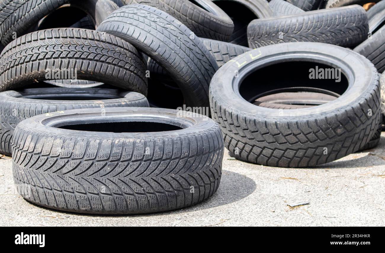 Worn wheels for recycling. Plant for burning tire dumps. Mountain of