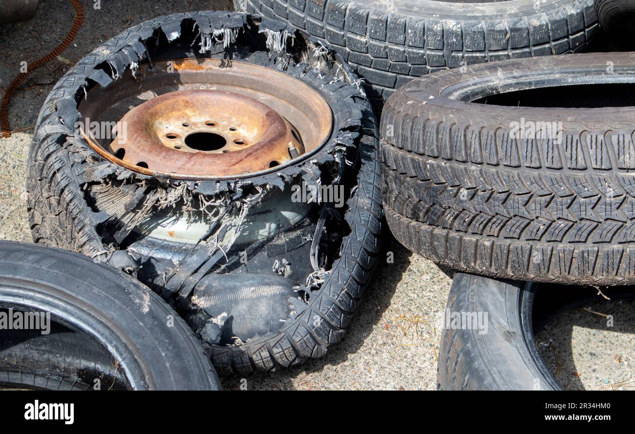 Worn wheels for recycling. Plant for burning tire dumps. Mountain of