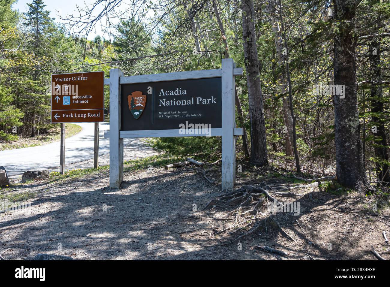 Acadia National sign and sign with directions to the Park Loop Road and the Visitor Center. Stock Photo