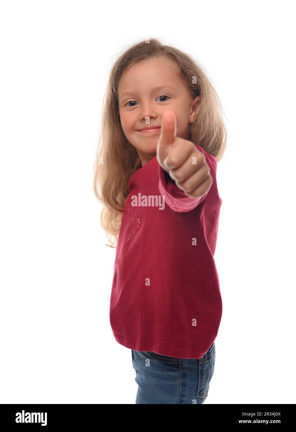 Little girl showing thumbs up on a white background Stock Photo - Alamy