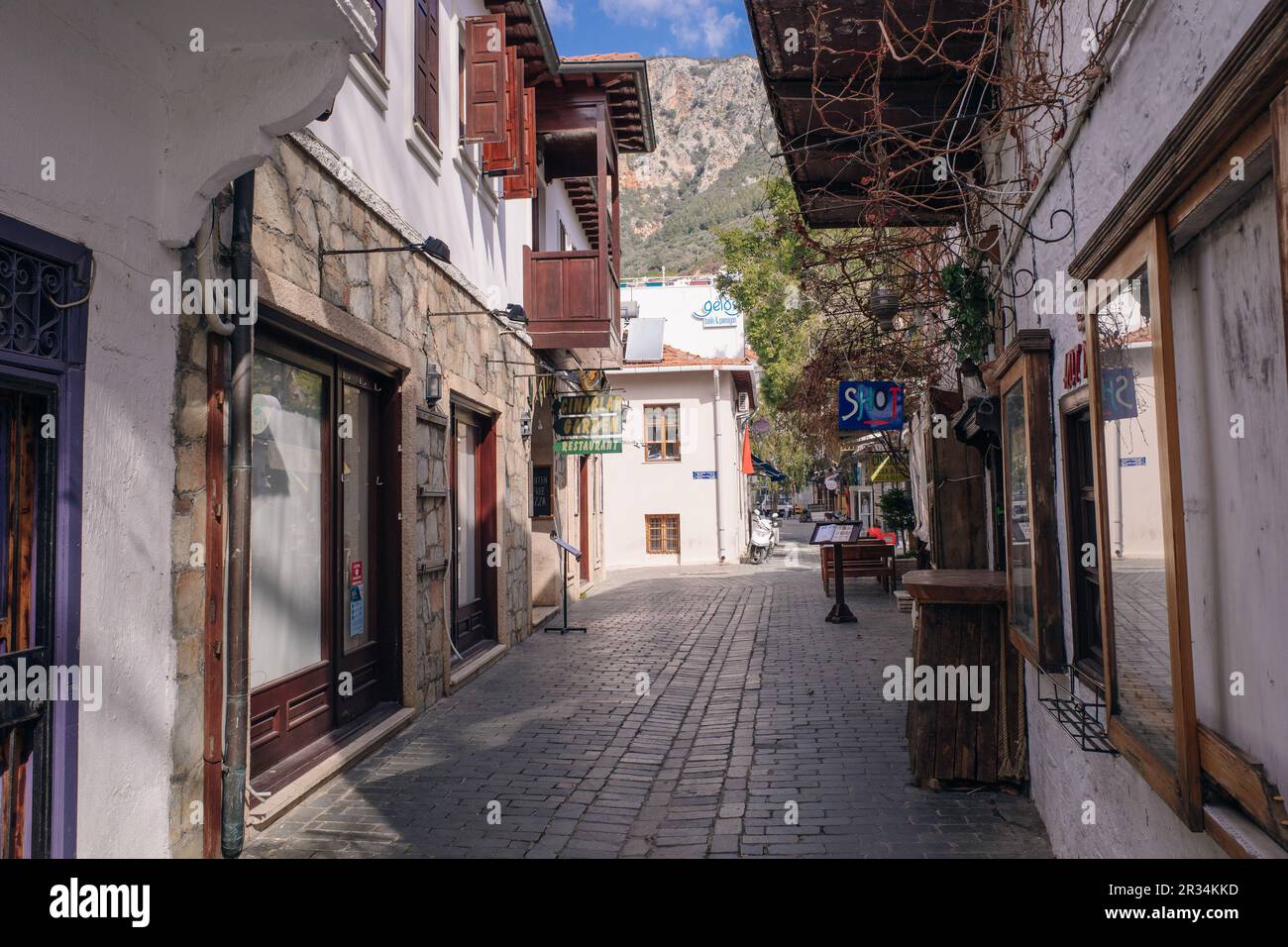 Beautiful street in the Kas old town with boutique shops at sunset, Turkey - may 2023. High quality photo Stock Photo