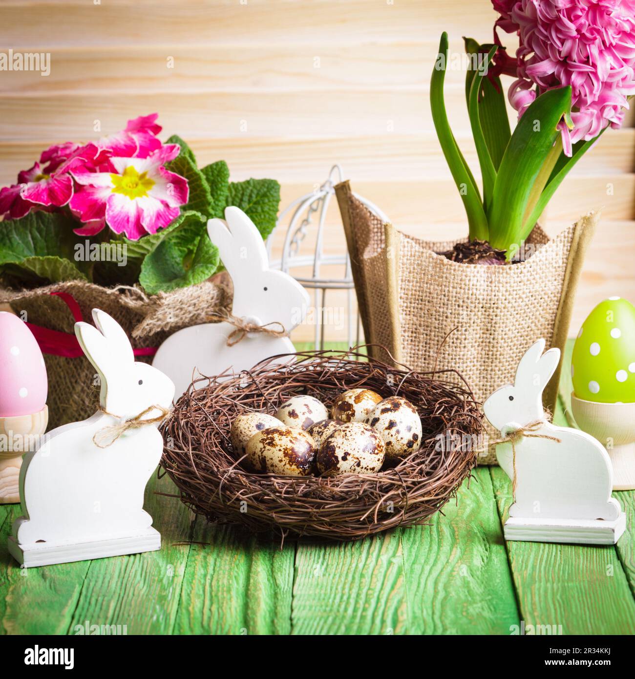 Bunnies with eggs and flowers hi-res stock photography and images - Alamy