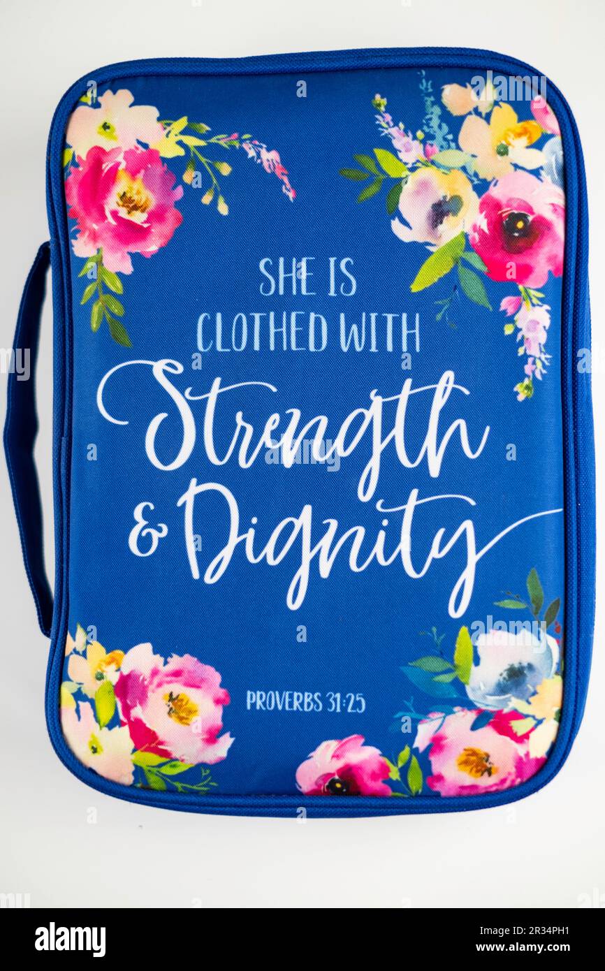 Colorful blue floral bible cover for a woman, with a message from Proverbs, isolated on a white background. USA. Stock Photo