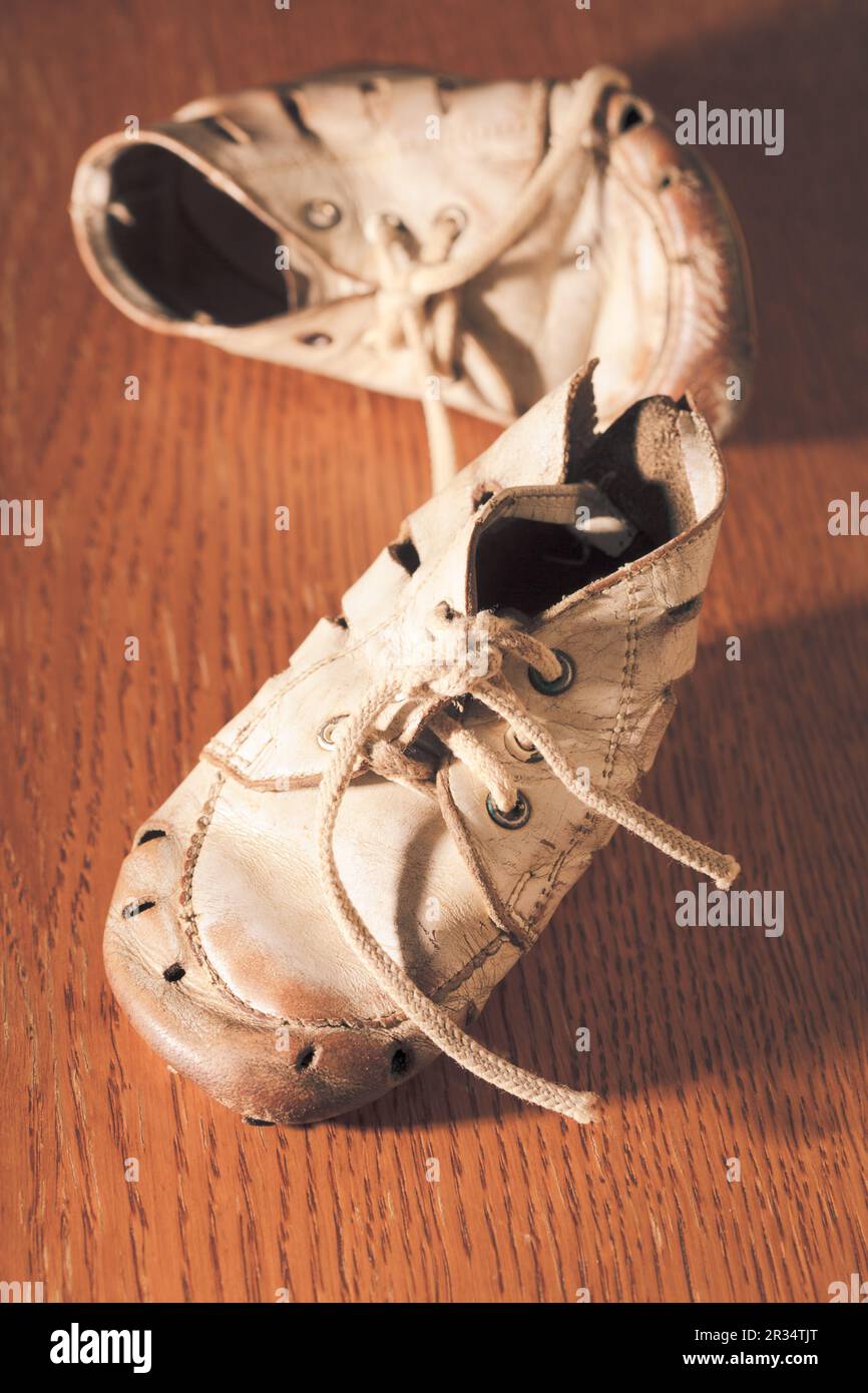 Old baby shoes Stock Photo - Alamy