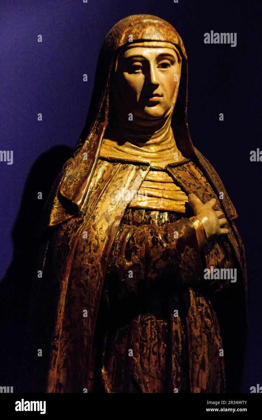 santa Monica, madera policromada, siglo XVII, encontrada en la iglesia del convento de Nossa Senhora Das Merces,museo de Evora,Evora,Alentejo,Portugal, europa. Stock Photo