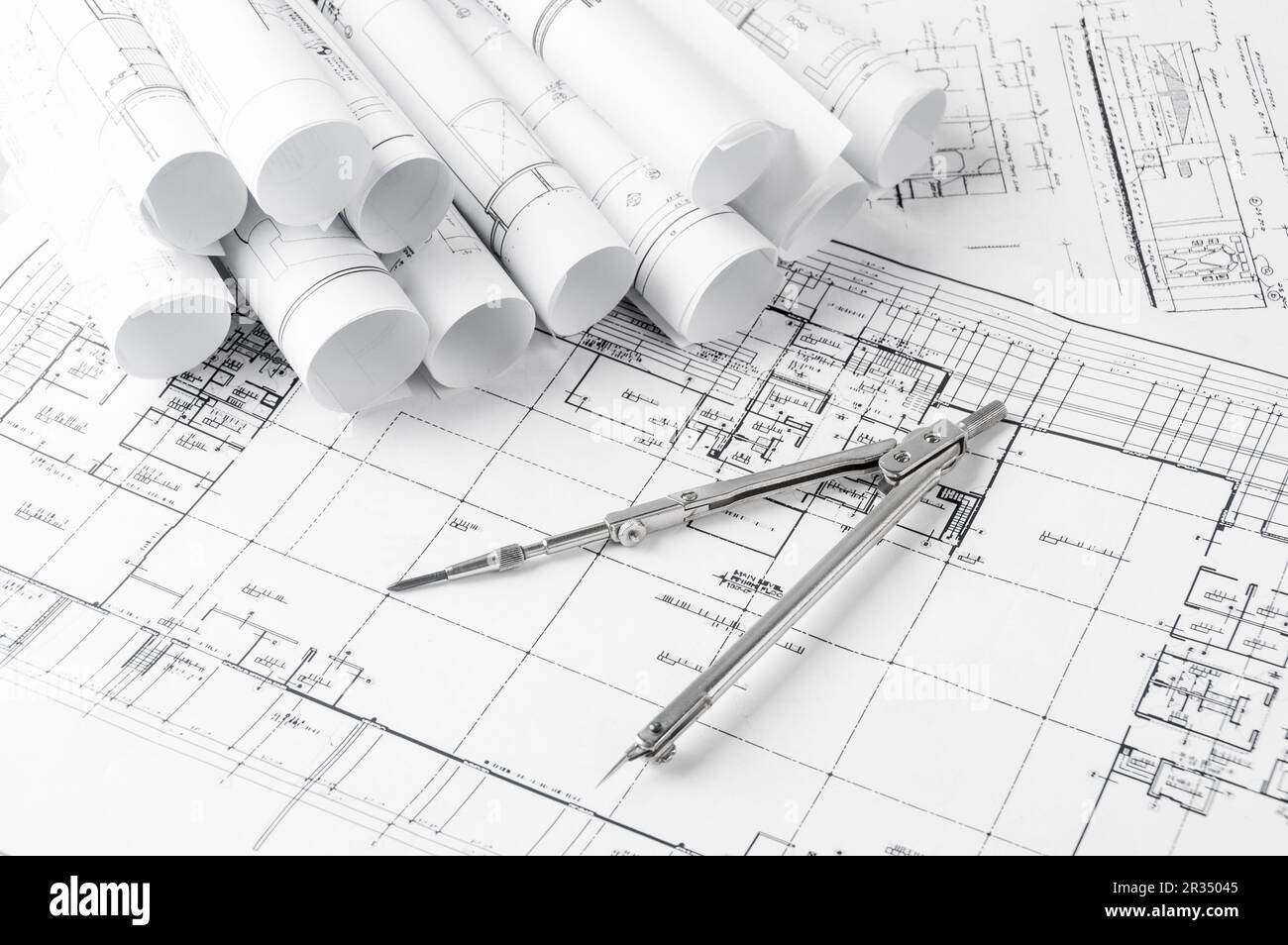 Rolls of architecture blueprints and house plans Stock Photo - Alamy