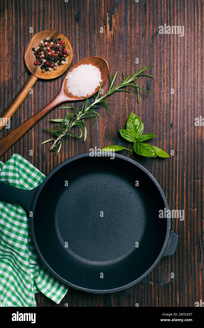 Frying pan and herbs Stock Photo