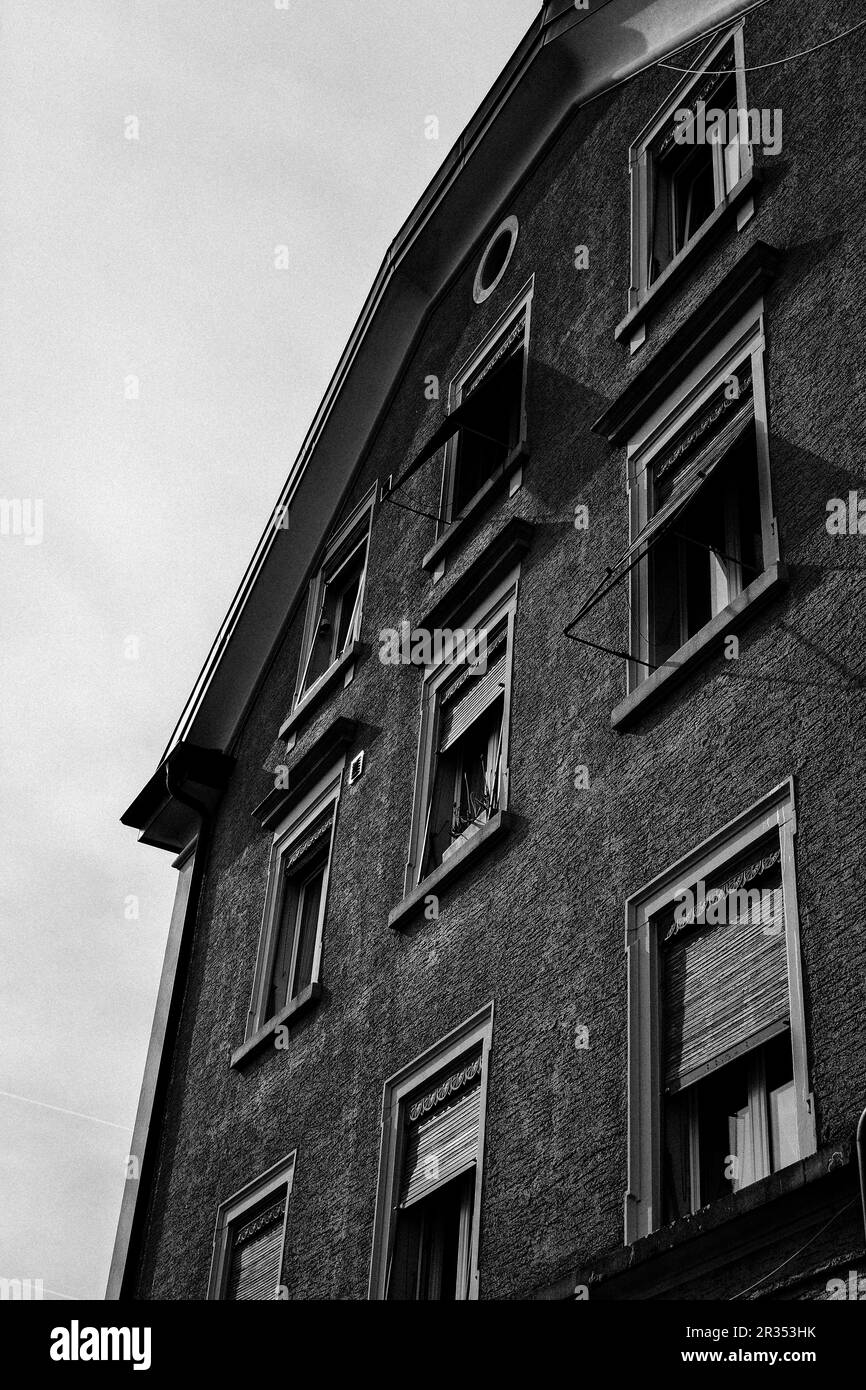 An old building, decaying with time, showcasing peeling paint