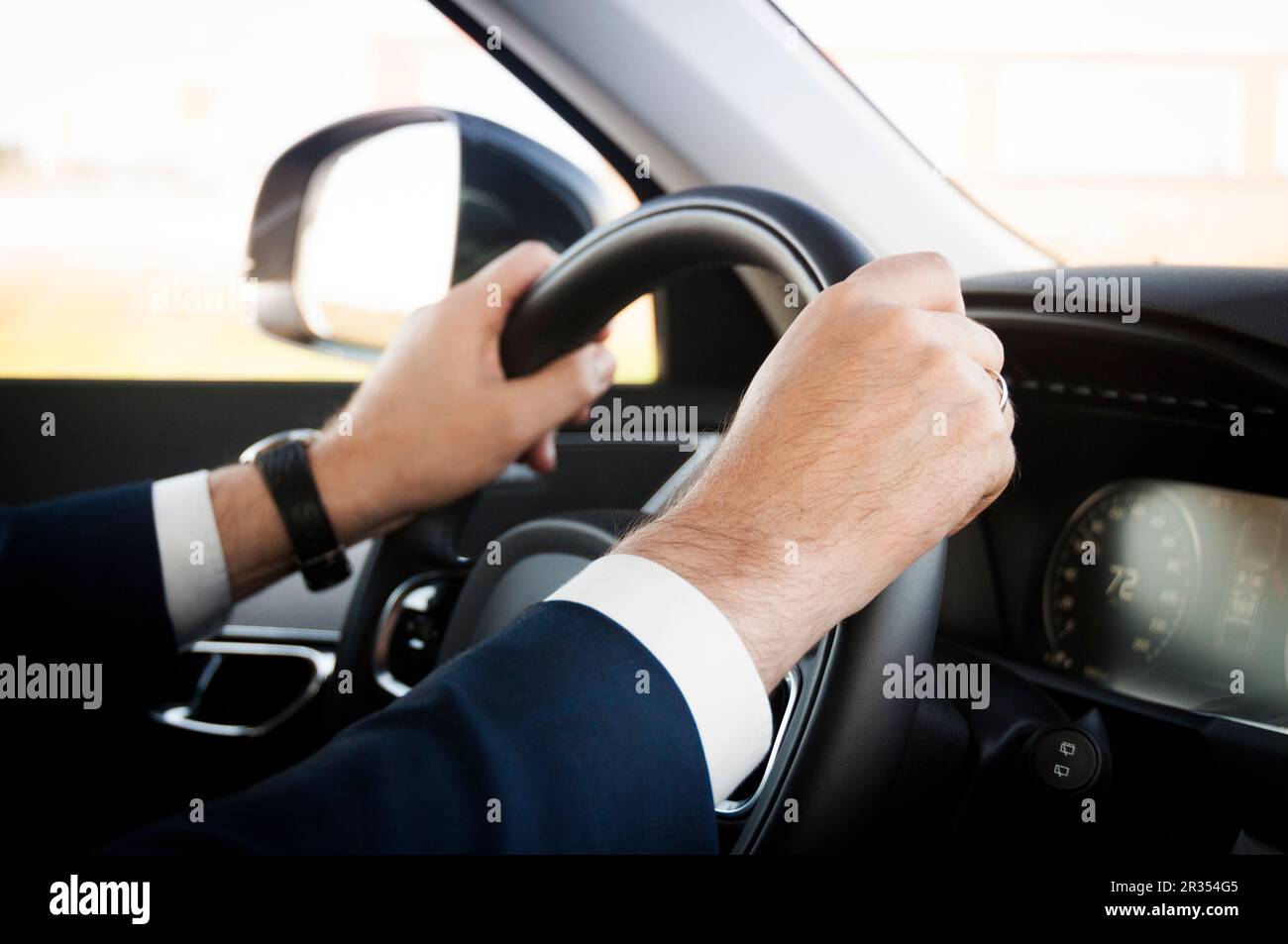 Hands on wheel Stock Photo Alamy