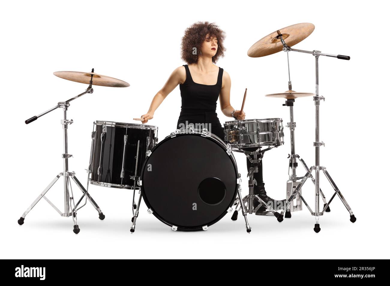 Female drummer performing isolated on white background Stock Photo