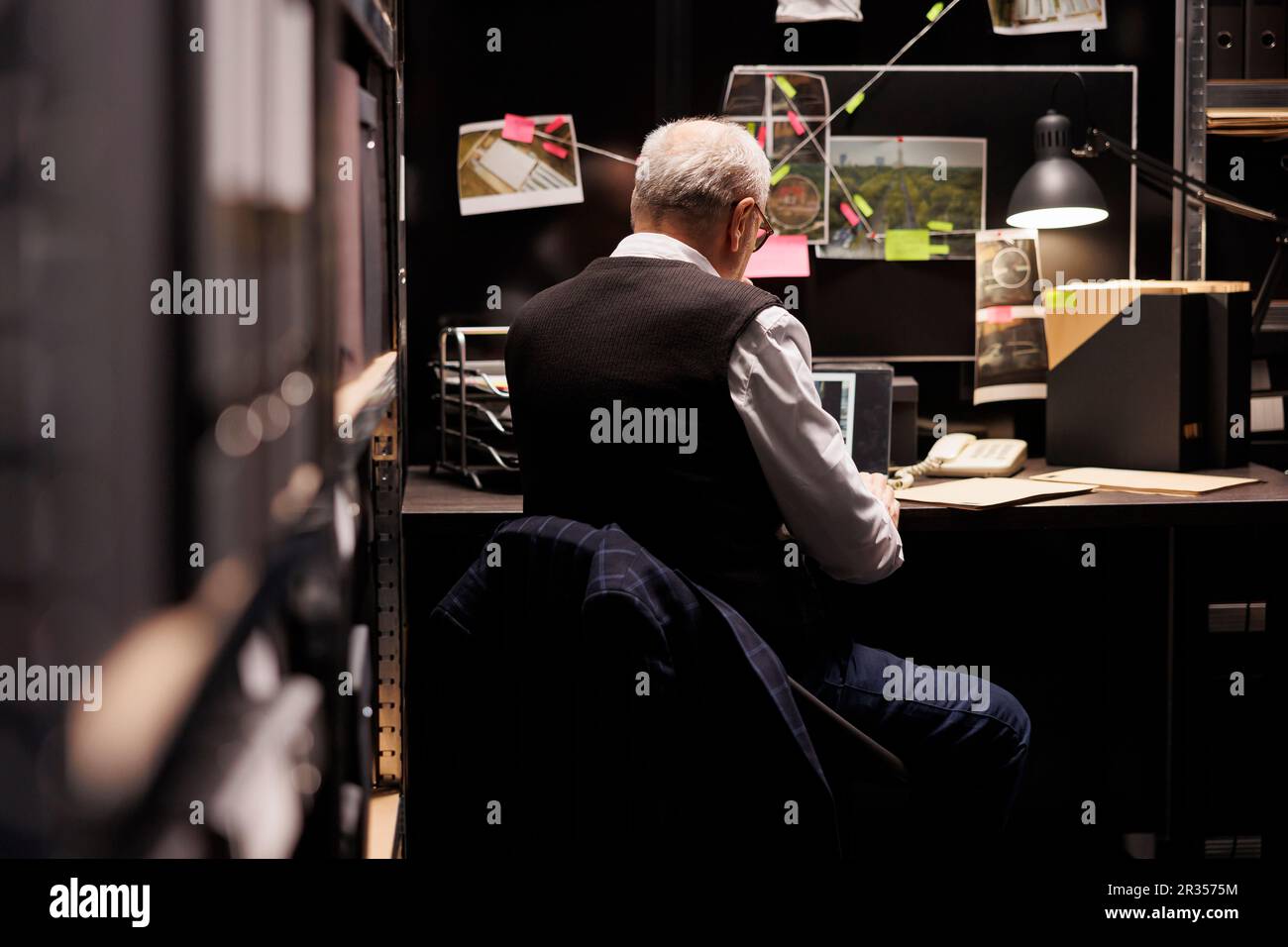 Fbi Interview Table Setting Elderly fbi investigator sitting at desk table in arhive room Stock ...