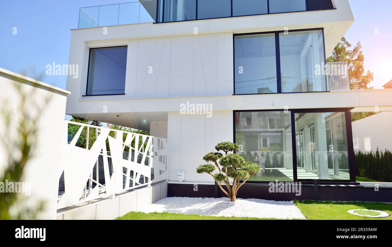 Elegant white house with open concept. Modern luxury villa exterior. A ...