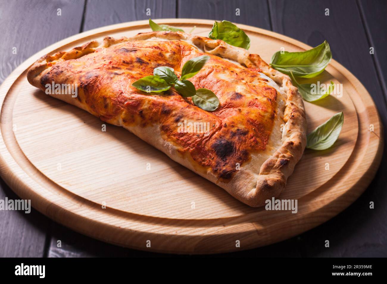 The Pizza calzone Stock Photo - Alamy
