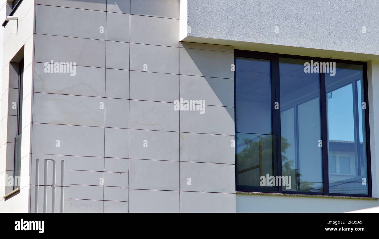 White apartment complex. A small fragment of a modern apartment building. Stock Photo