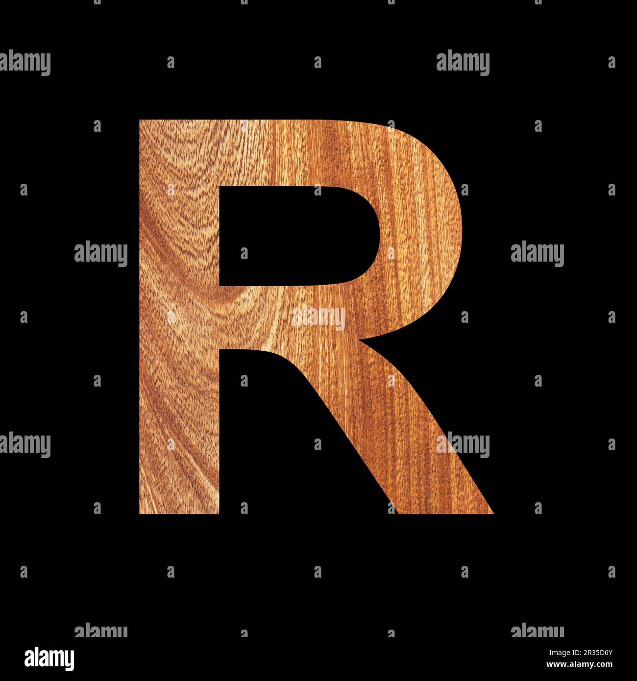 Capital letter R on oak wood background - Black background Stock Photo ...