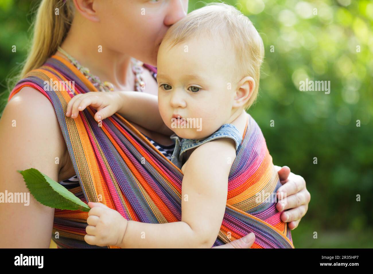 Baby in sling Stock Photo Alamy