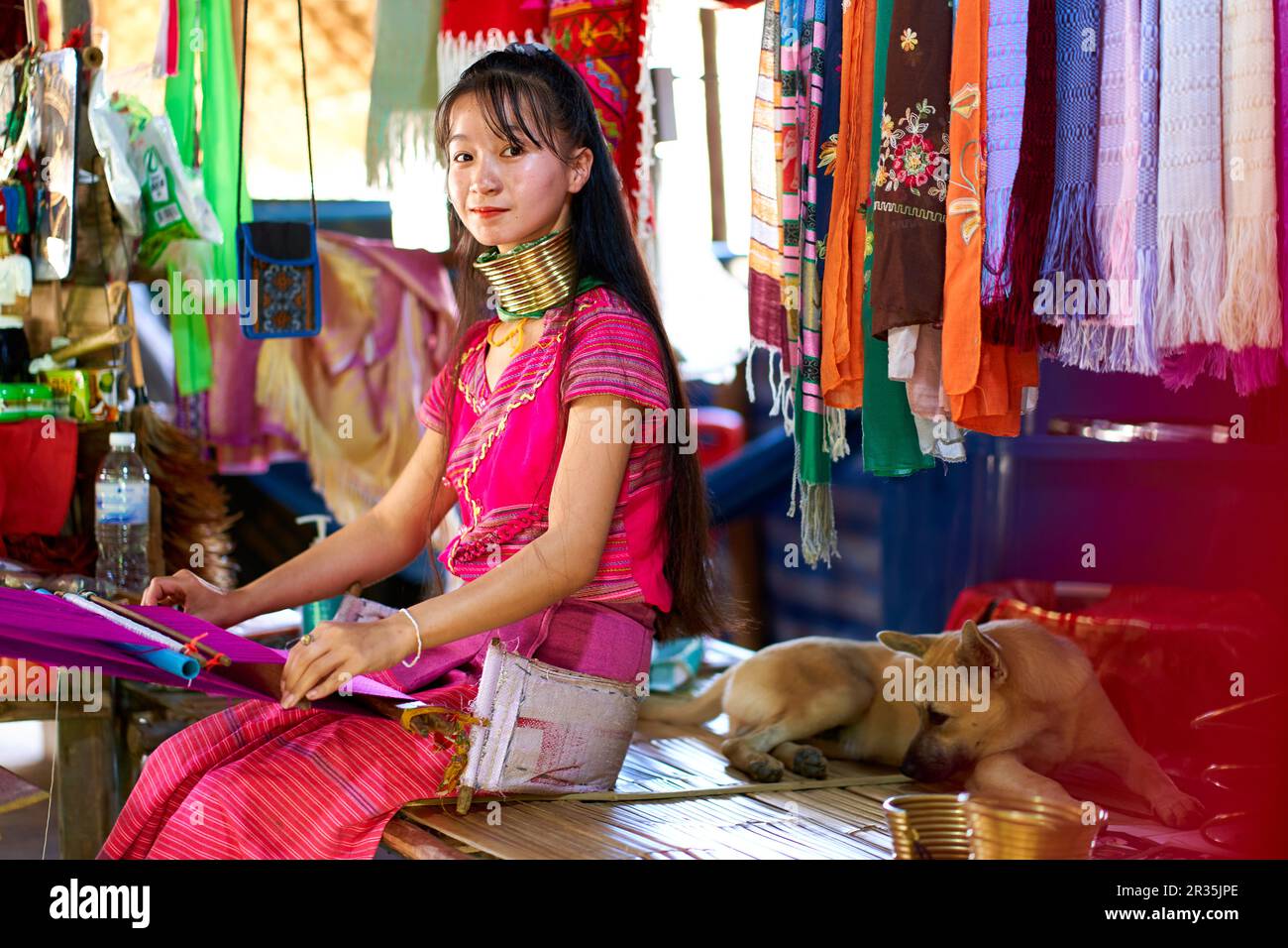 A portrait of a woman from a longnecked tribe, known for the metal