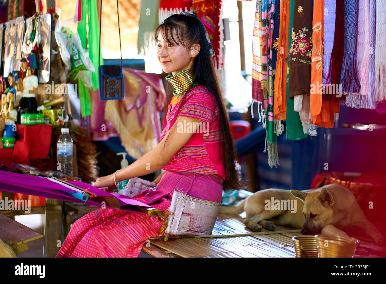 A portrait of a woman from a longnecked tribe, known for the metal