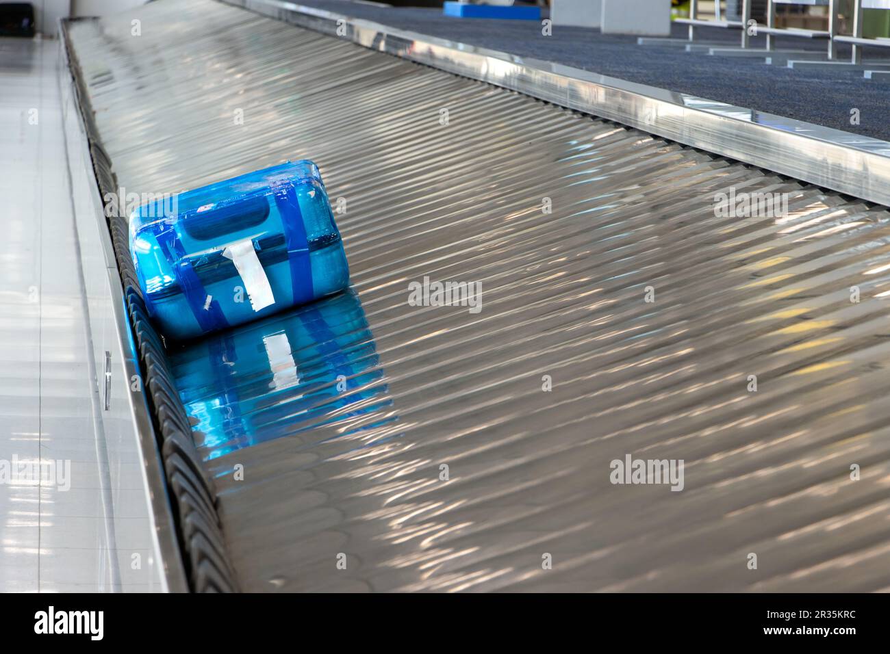 The passengers' suitcases rotate on the belt at airport Stock Photo