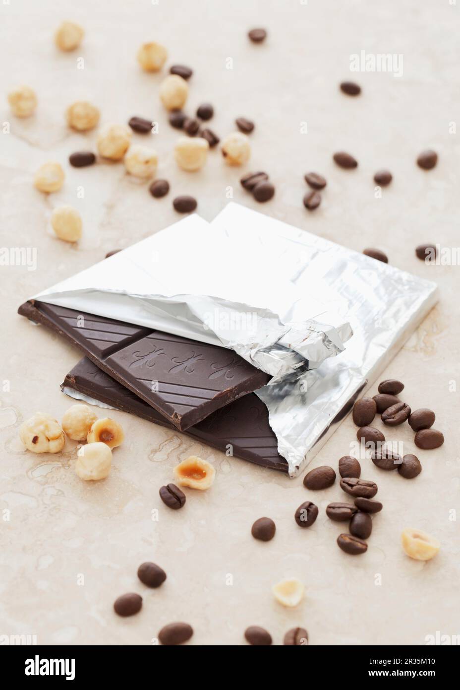 Dark chocolate, hazelnuts and coffee beans Stock Photo