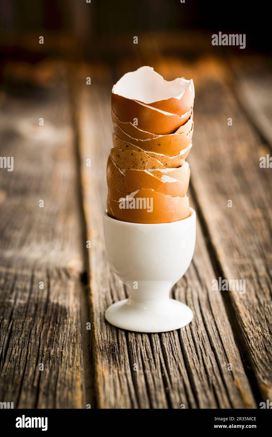 A stack of empty egg shells in an egg cup Stock Photo Alamy