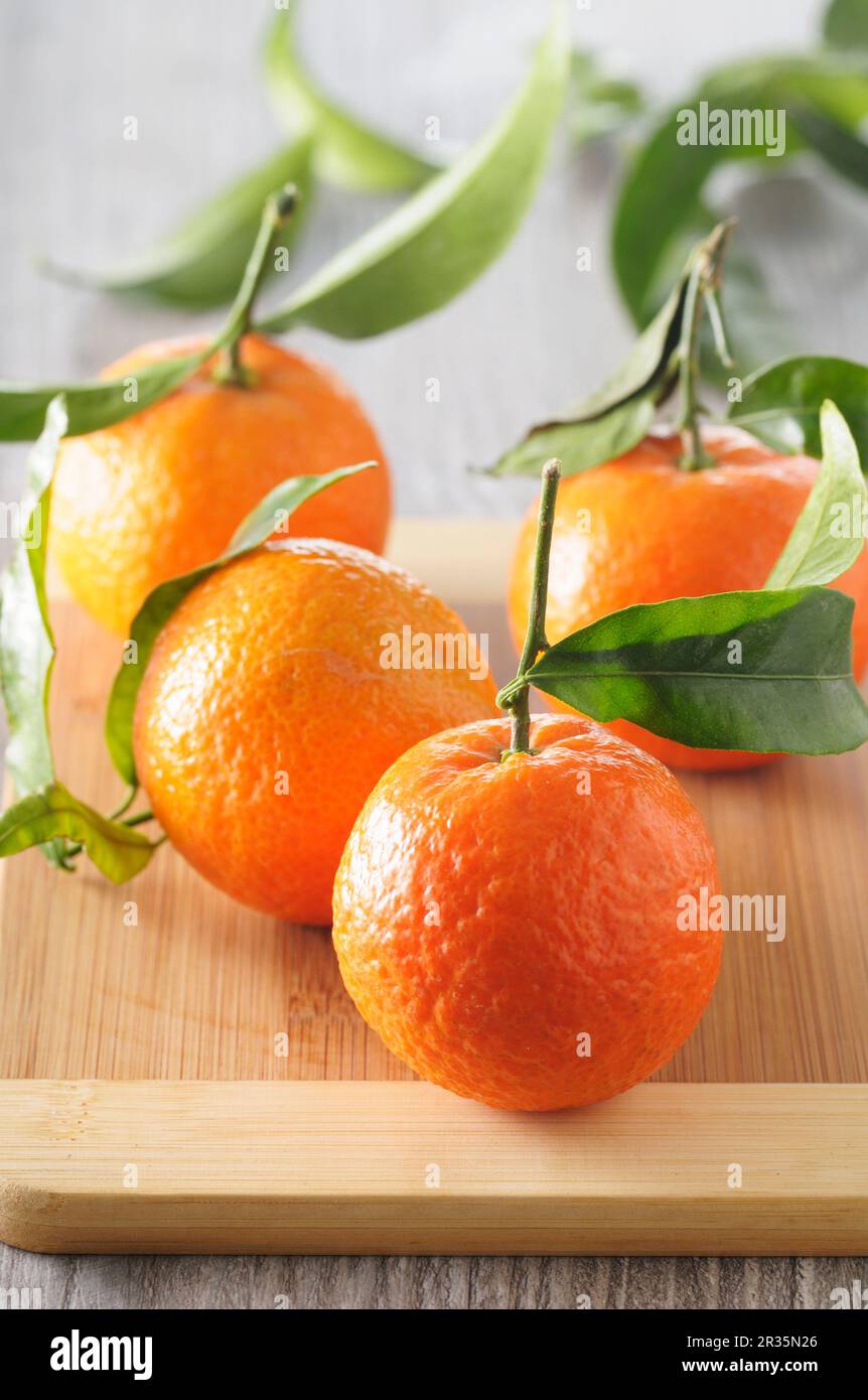 Clementines with leaves Stock Photo Alamy