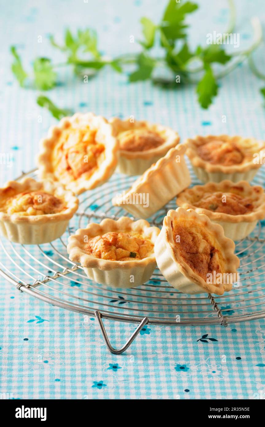 Spicy mini quiche on a cooling rack Stock Photo
