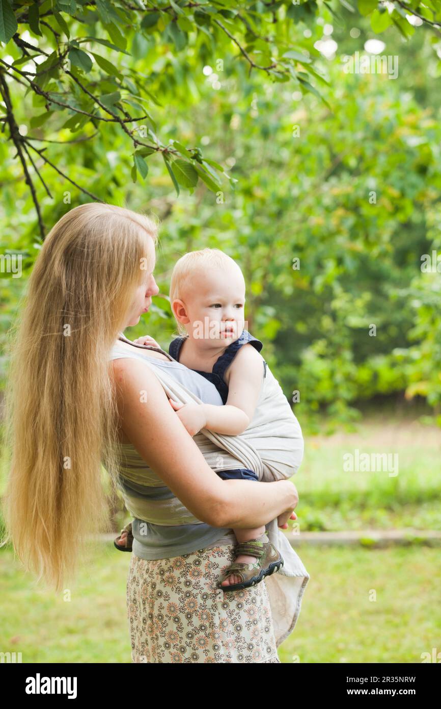 Baby in sling Stock Photo