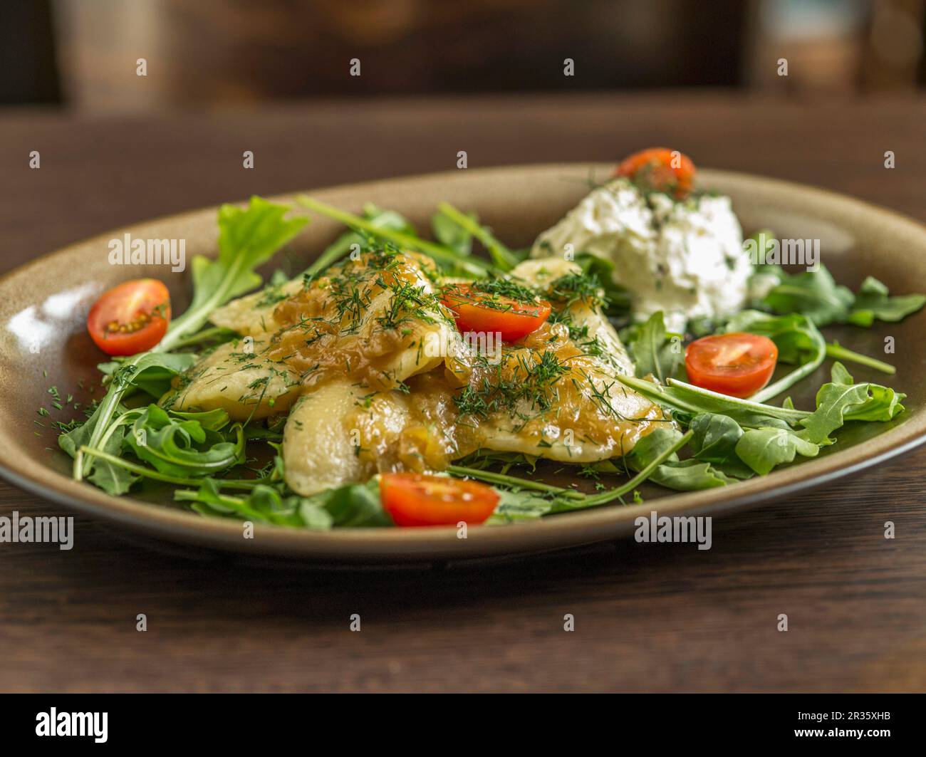 Fish with dill, cocktail tomatoes and rocket Stock Photo Alamy